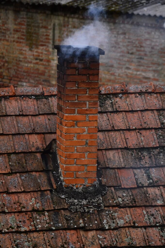 Chimney with smoke coming out safely after professional cleaning in Mishawaka Indiana