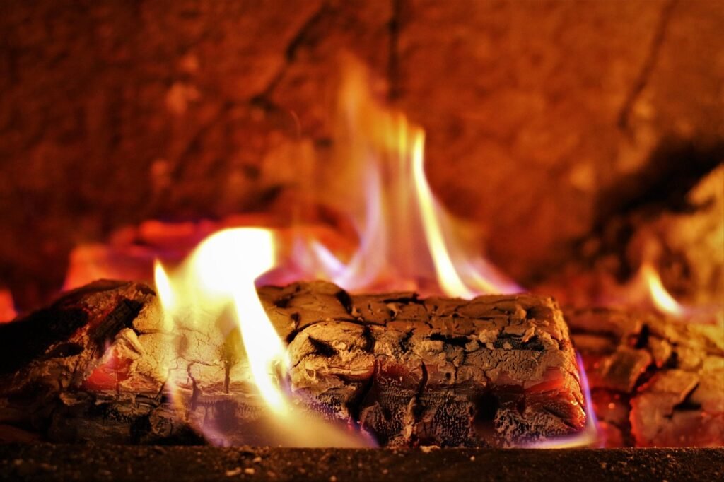 Log burning safely in a clean fireplace after professional chimney cleaning in South Bend Indiana