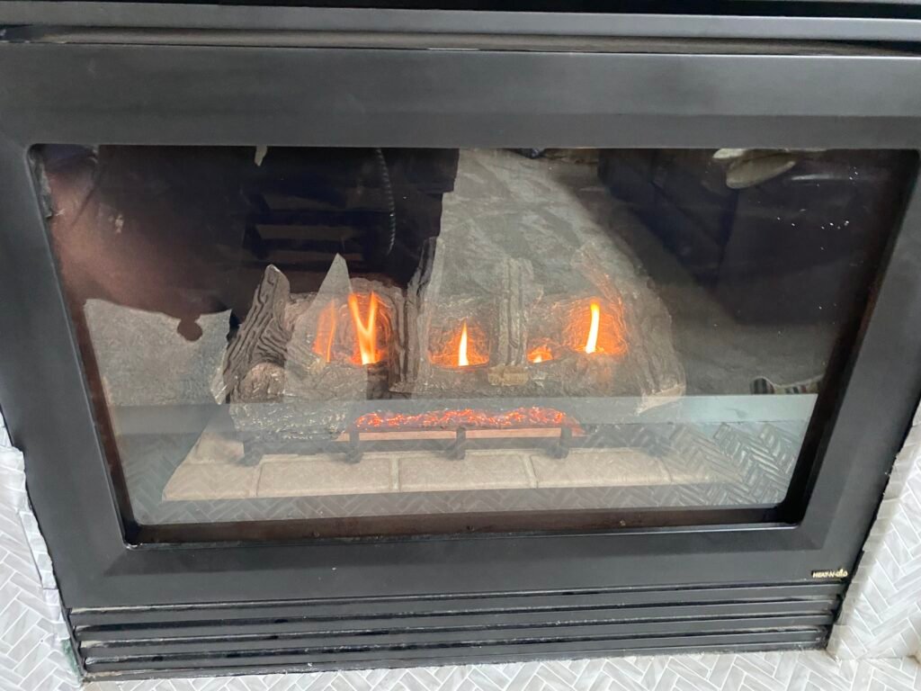 Gas fireplace burning safely after professional service