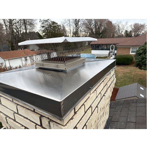 Aluminum chimney cap installed on residential chimney