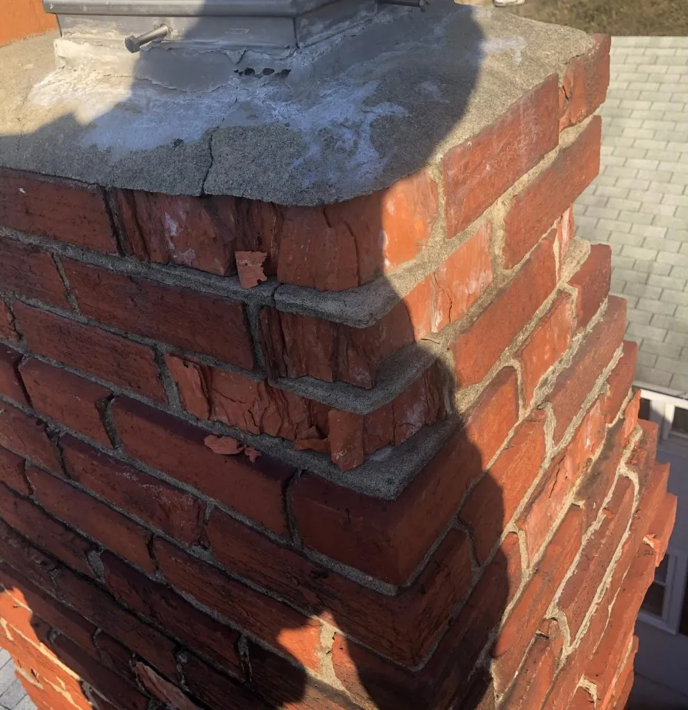 Chimney brick deterioration requiring masonry repair