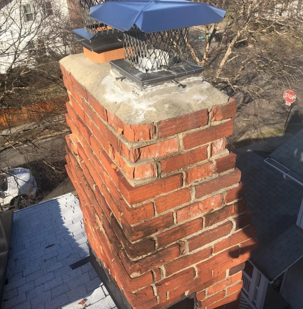Damaged chimney bricks showing deterioration and cracking