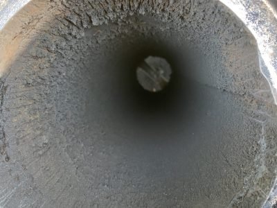 Dirty chimney flue before professional cleaning showing heavy creosote buildup in South Bend Indiana